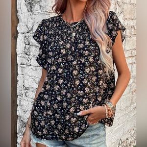 Floral print ruffle trim short sleeve black top